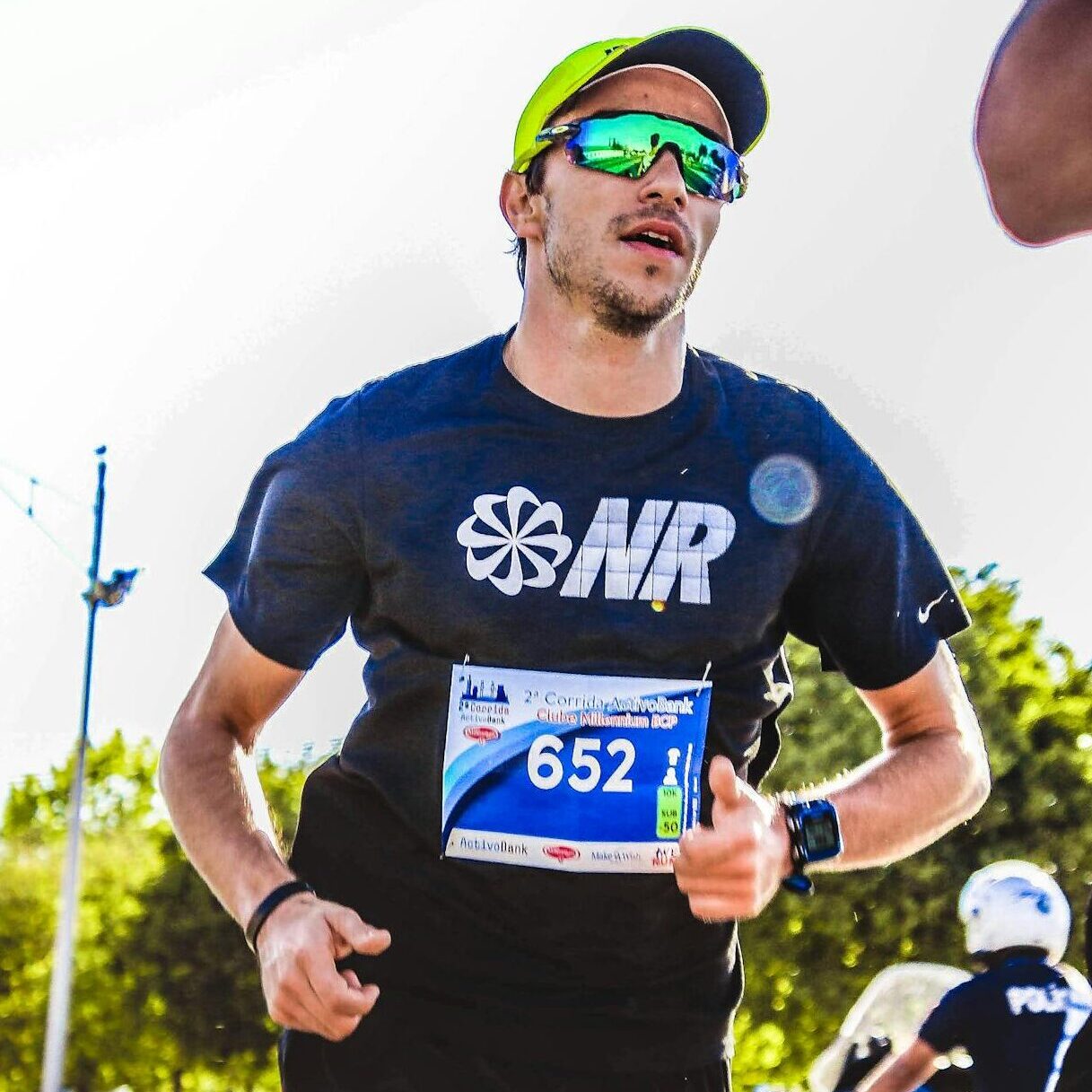 Dynamic capture of marathon runners competing outdoors on a sunny day.